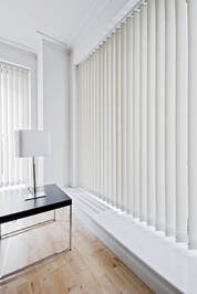 modern room with vertical window blinds